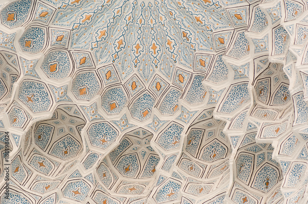 The ceiling is carved with ancient Asian ornament. the details of the architecture of medieval Central Asia