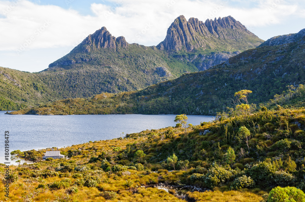 The jagged peak of Cradle Mountain looms above Dove Lake - Tasmania, Australia