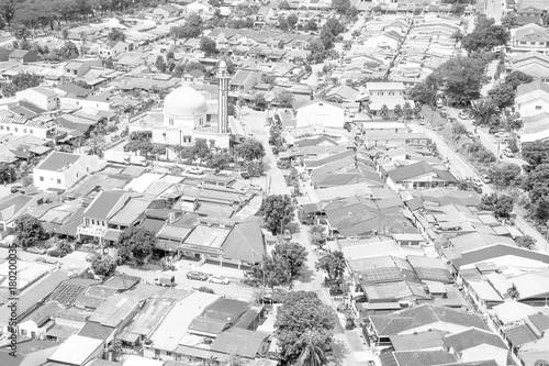 Canvas Print Aerial view of mosque surrounded in suburb of Kuala Lumpur black and white
