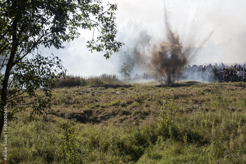 Explosion in the forest, September 24, 2017 in Russia, Leningrad region, Neva heel, reconstruction of the Second World War near the Neva River. Explosion in the forest, September 24, 2017 in Russia, Leningrad region, Neva heel, reconstruction of the Second World War near the Neva River.