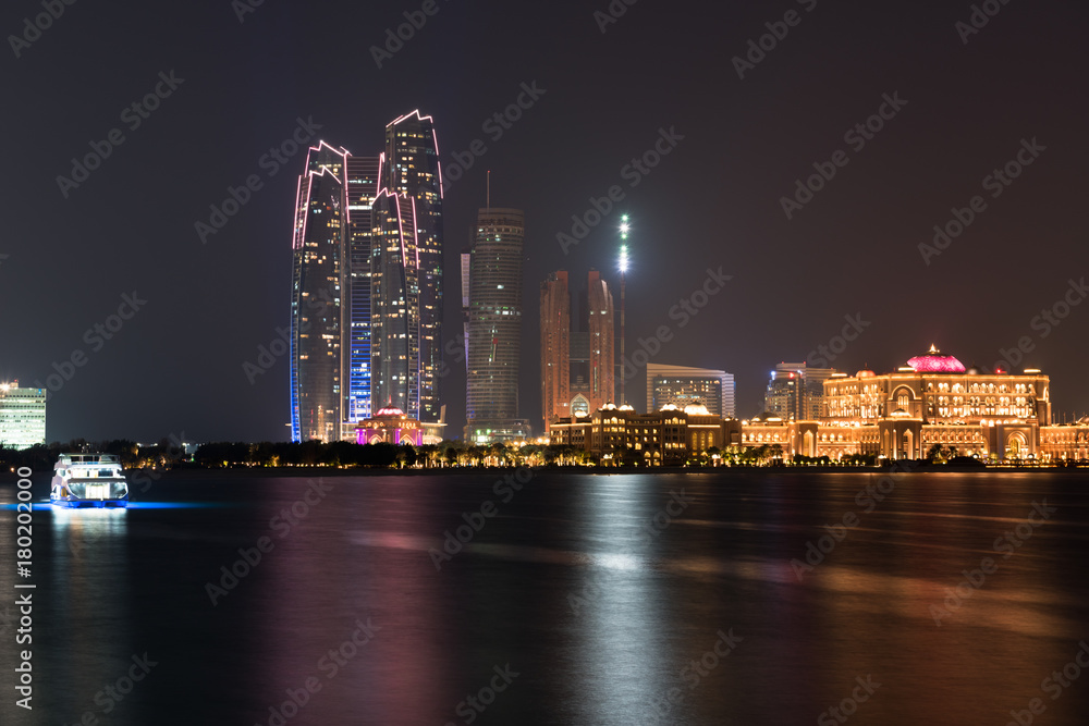Abu Dhabi buildings skyline from the sea at night Abu Dhabi buildings skyline from the sea at night