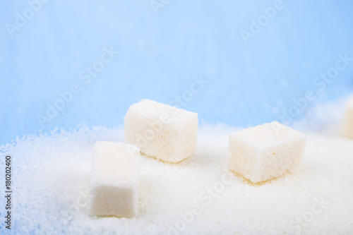 White sugar and cubes of sugar