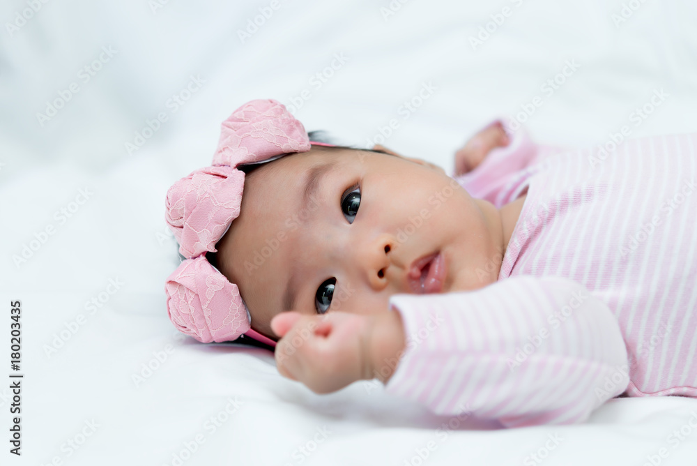 Close up asian baby girl cry on white wool carpet Close up asian baby girl cry on white wool carpet