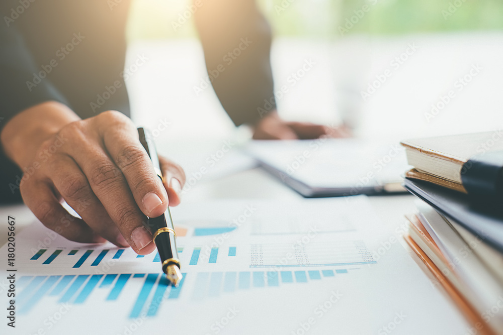 Business concept. Business people discussing the charts and graphs showing the results of their successful teamwork. Business concept. Business people discussing the charts and graphs showing the results of their successful teamwork.