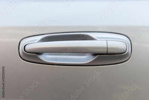 Silver car door handle close up