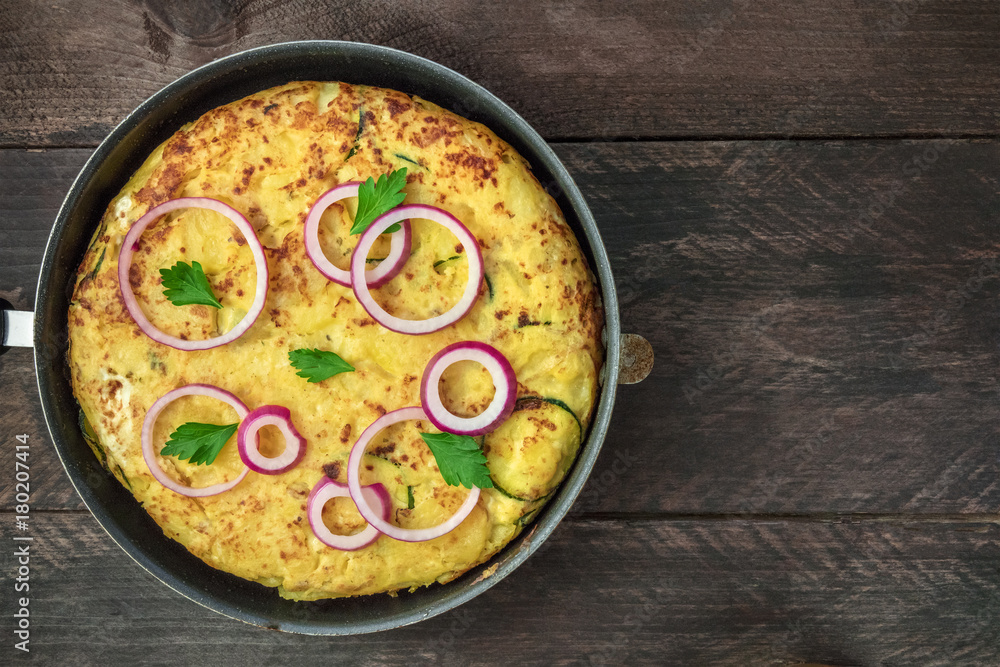 Spanish tortilla in tortillera with copy space, top view Spanish tortilla in tortillera with copy space, top view