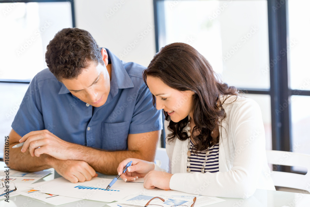 Image of two young business people in office Image of two young business people in office