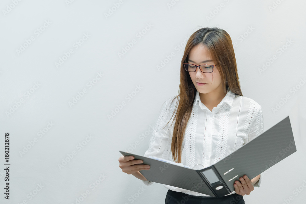Asian girl wearing glasses with document file on white background,Thai business woman Asian girl wearing glasses with document file on white background,Thai business woman