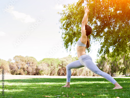 Young woman practicing yoga in the park