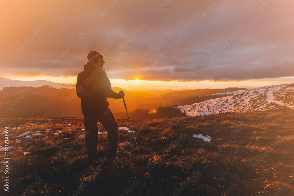 Hiker standing on top of a mountain