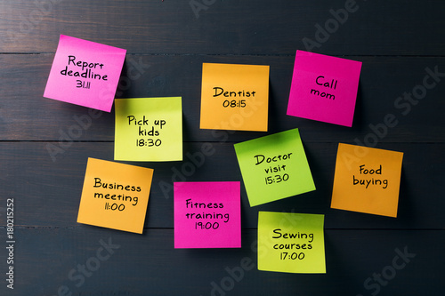 colorful sticky notes with busy woman schedule photo
