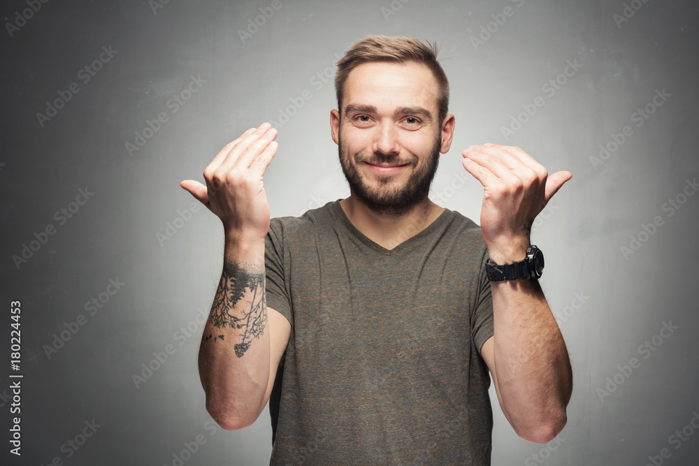 Handsome man showing inviting gesture. Handsome man showing inviting gesture.