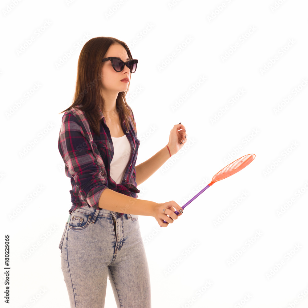 Young cute woman with fly swatter, isolated Young cute woman with fly swatter, isolated