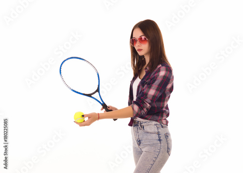 Young cute girl with tennis racket, isolated 