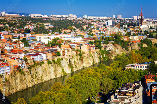 Tourustic ride on the funicular, aerial view from the top on the houses with traditional wooden carving balconies of Old Town of Tbilisi, Georgia photo