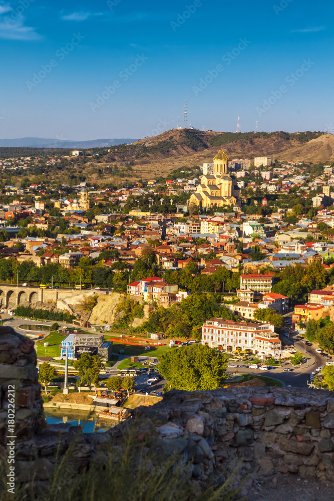 Aerial view from the top on the houses of Old Town of Tbilisi, Kura river and Sameba Cathedral Holy Trinity Georgia