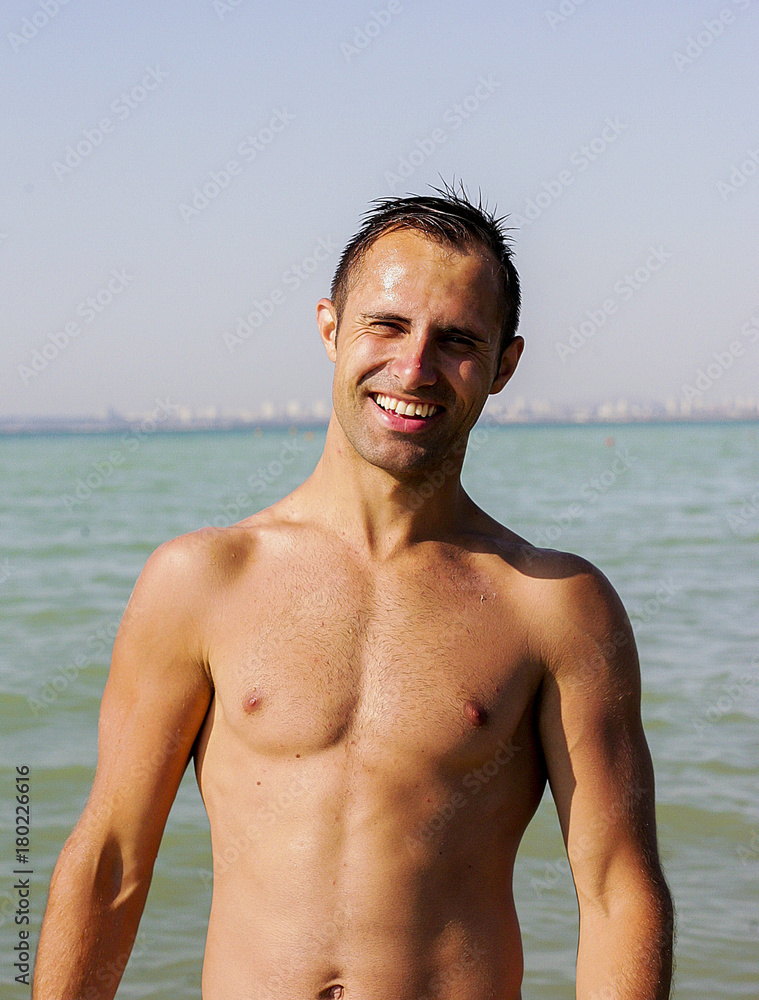 Lovely guy smiling at the camera Lovely guy smiling at the camera