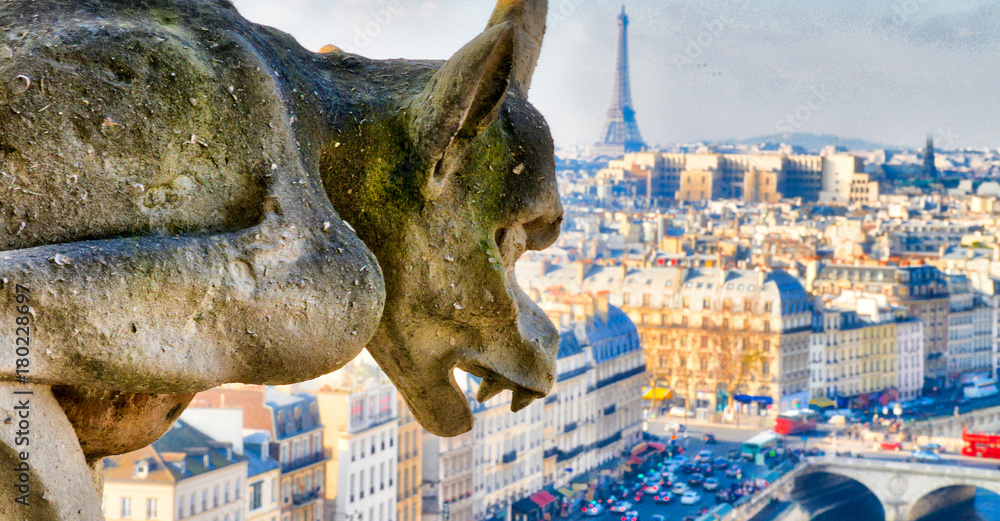 Chimera (Gargoyle) of the Cathedral of Notre Dame de Paris overlooking Paris on a beautiful sunny day