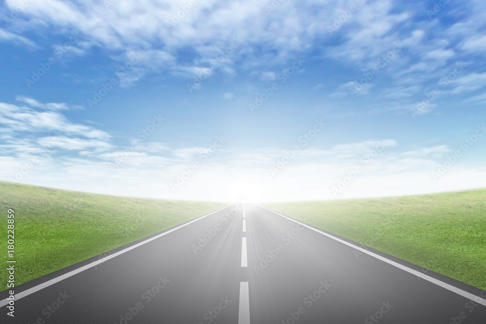 asphalt road through the green field and clouds on blue sky in summer day asphalt road through the green field and clouds on blue sky in summer day
