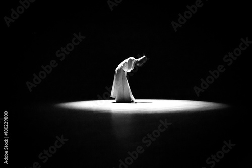 Obraz na płótnie the image of a whirling Dervish in the darkness
