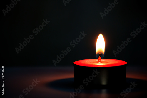 Candle light on a dark background.