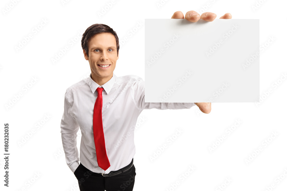Young businessman showing a blank card