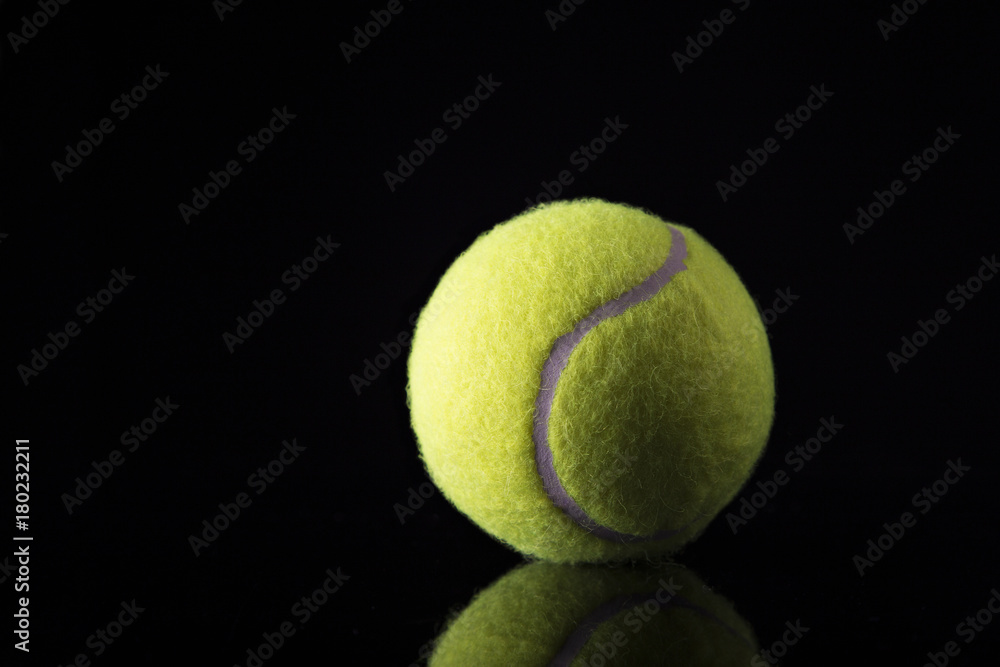 Tennis ball on black