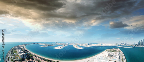 Photography Dubai Palm Jumeirah Island at dusk, aerial view
