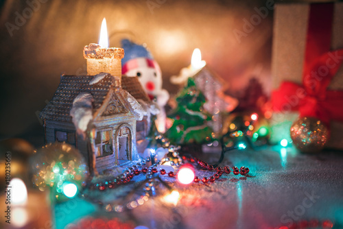 Christmas decorations, burning candles, garlands, lights, balls photo