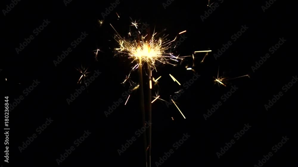 Slow motion : Bright burning Christmas sparkle on black background Slow motion : Bright burning Christmas sparkle on black background