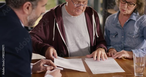 Senior Couple checking Forms at home photo