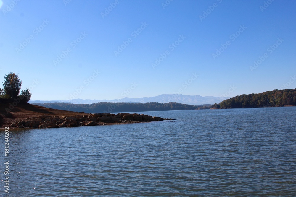 A beautiful morning at the lake with the mountain ranges in the background. A beautiful morning at the lake with the mountain ranges in the background.