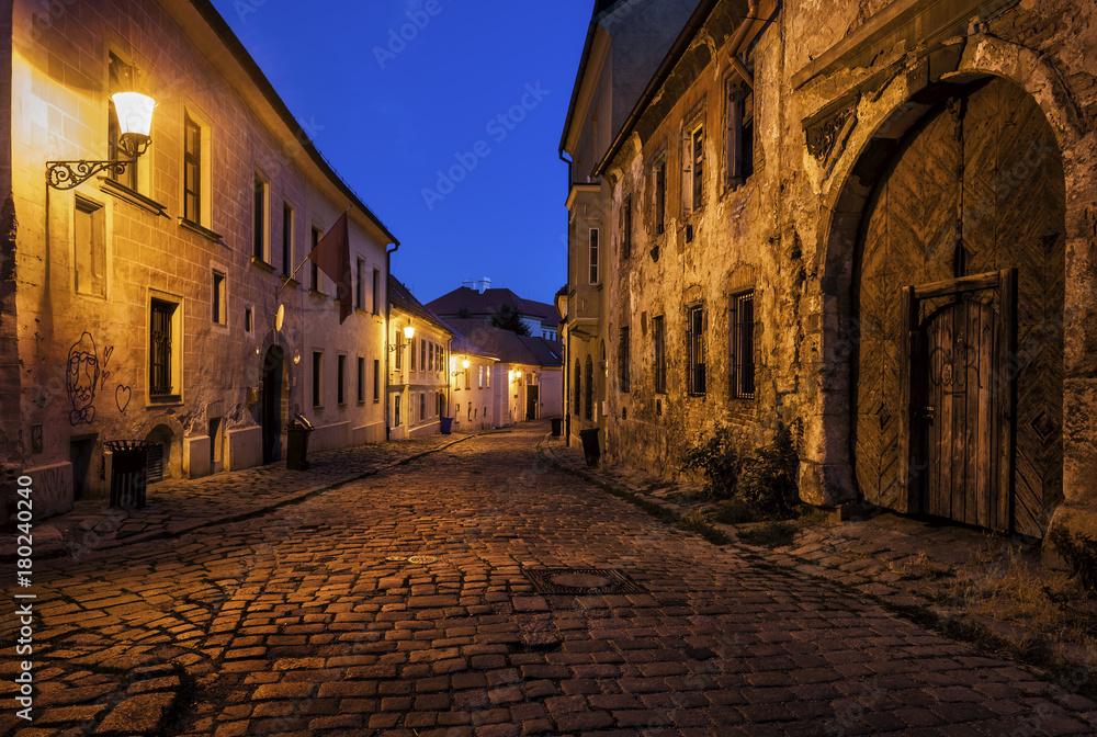 Slovakia, Bratislava, Old Town at night, cobbled street, old building with aged facade