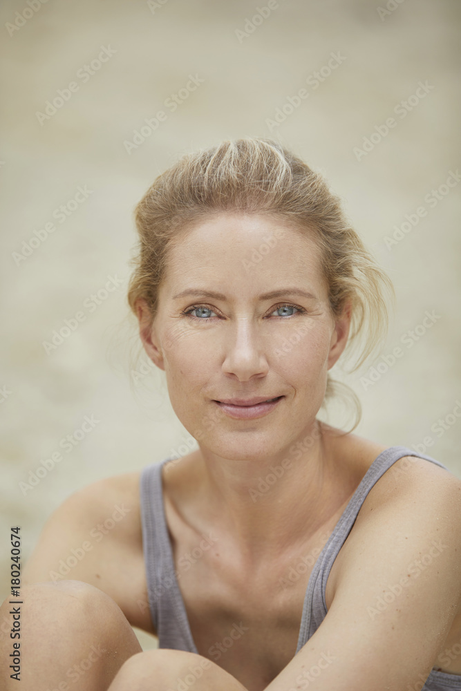 Portrait of smiling blond woman on the beach Portrait of smiling blond woman on the beach