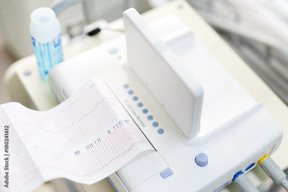 Cardiotocograph device in a hospital to examine fetus heartbeat and make cardiogram while pregnancy Cardiotocograph device in a hospital to examine fetus heartbeat and make cardiogram while pregnancy