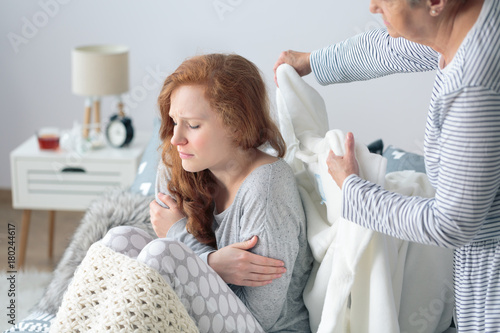 Mother taking care about daughter photo