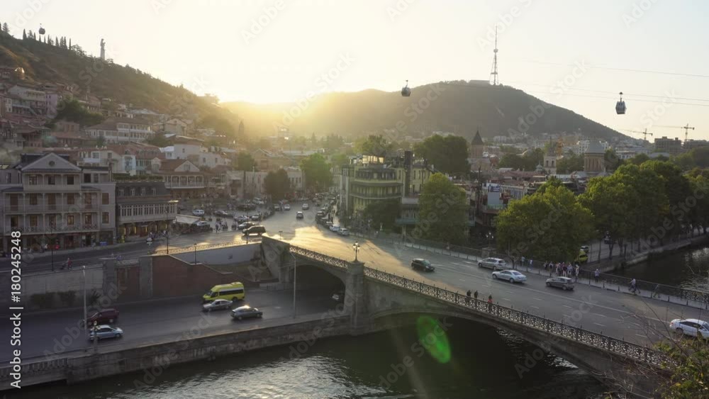 Panorama view of Tbilisi, capital of Georgia country. Cable road above tiled roofs. Panorama view of Tbilisi, capital of Georgia country. Cable road above tiled roofs.