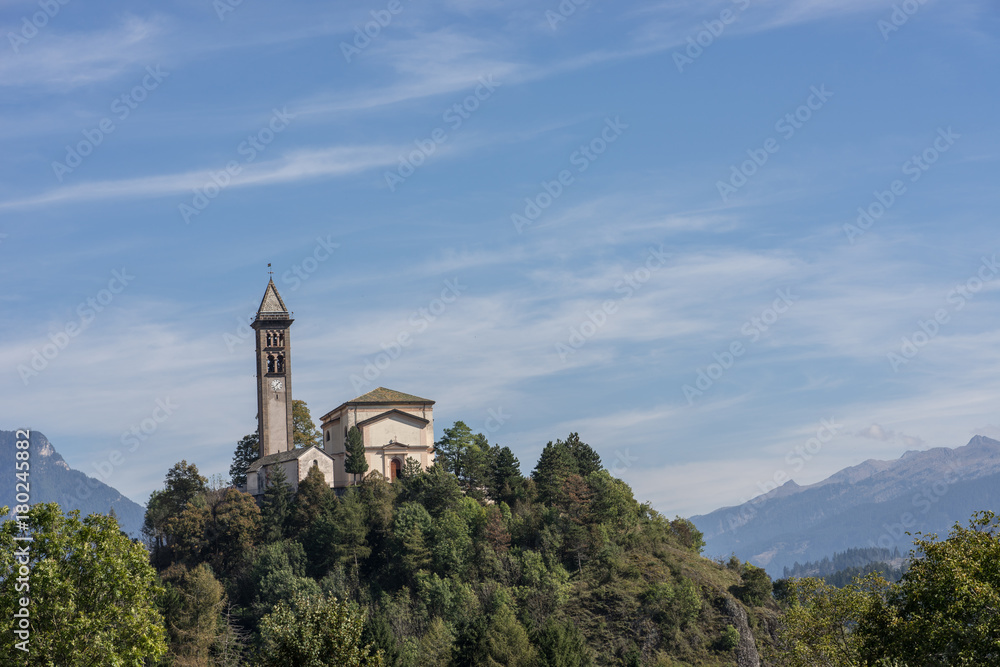 Castle on the hill landscape, mountains and peaks in background. Trentino South Tirol Castello Molina Di Fiemme, Alto Adige, Italy - Saint George Church