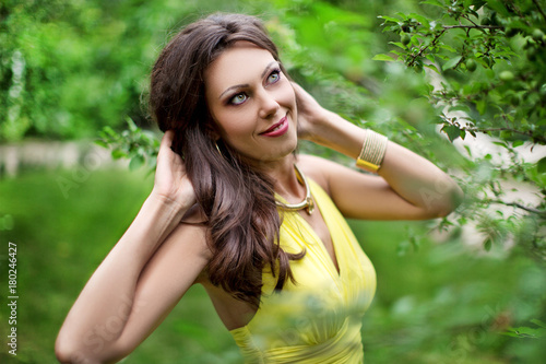 Wonderful girl in yellow dress  closeup. Creative portrait of girl