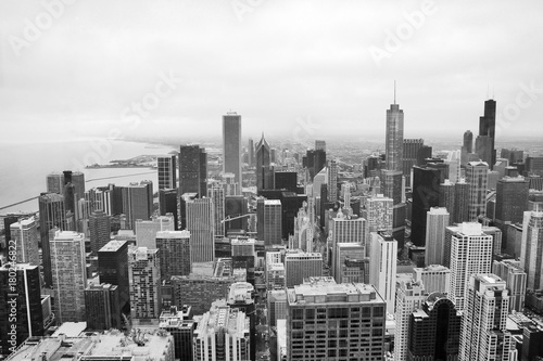 Urban city architecture background.Chicago skyline aerial view.An overhead view of the city of Chicago downtown taken from the John Hancock Center skyscraper.Horizontal composition in black and white.