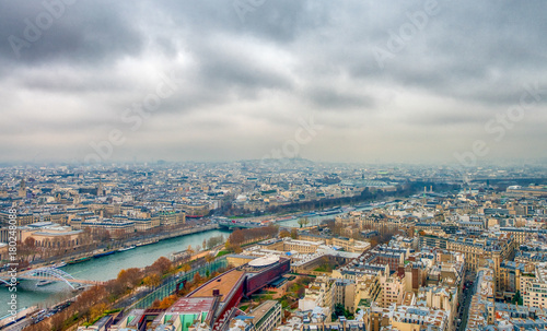 Fototapeta Naklejka Na Ścianę i Meble -  Paris aerial skyline with Seine river on a cloudy winter day, Fr