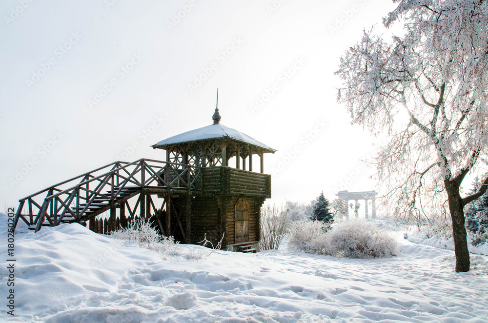 A watchtower wooden tower in winter, when there is a lot of snow. Poltava, Ukraine A watchtower wooden tower in winter, when there is a lot of snow. Poltava, Ukraine