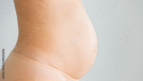 belly of pregnant woman, profile