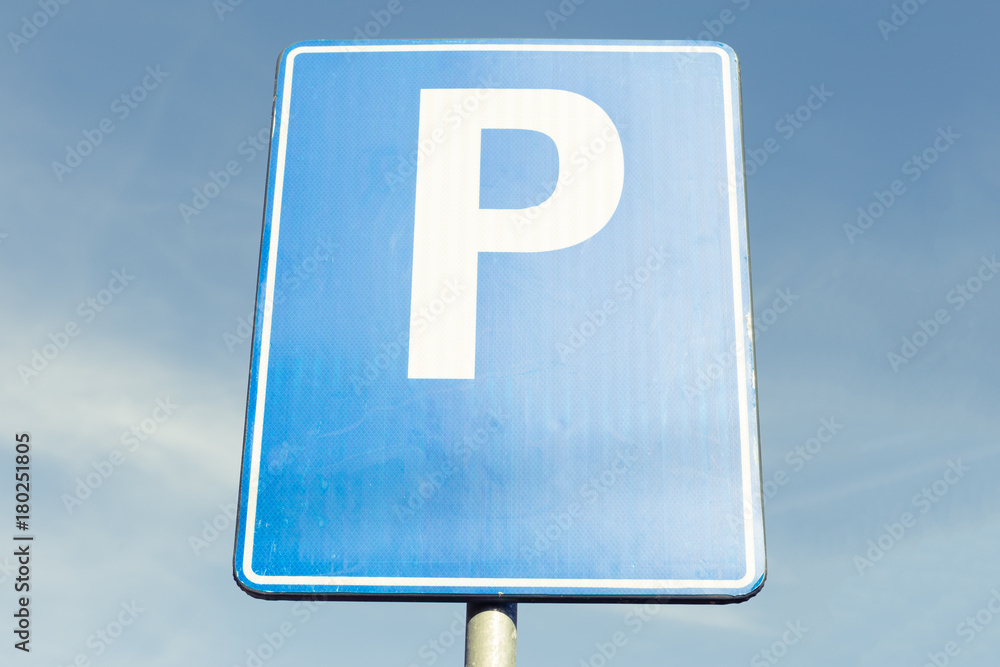 Parking ahead road sign on blue metal plate Parking ahead road sign on blue metal plate