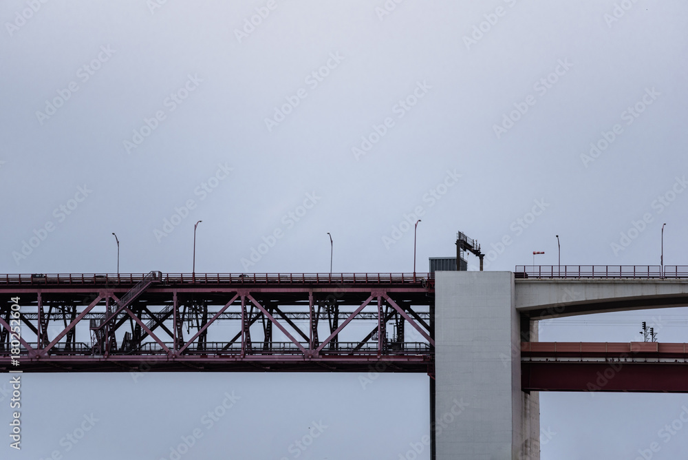 Sideview of red steel beam and concrete pillar bridge Sideview of red steel beam and concrete pillar bridge