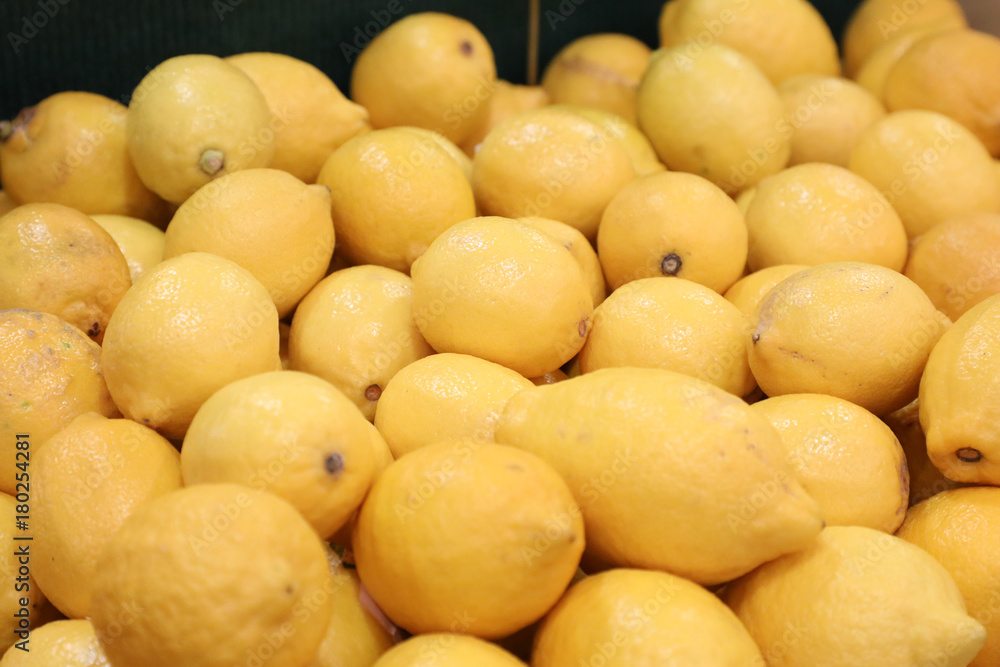 Fresh yellow lemons at the market