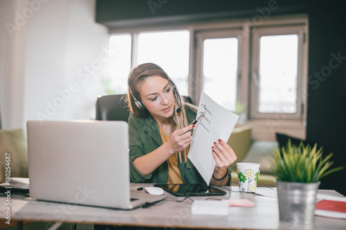 Young English teacher giving online lessons