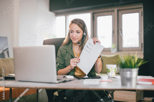 Young English teacher giving online lessons