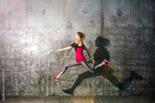 Woman running in urban area 