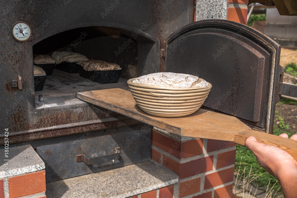 Bread in a traditional way, homemade, bake bread in wooden oven